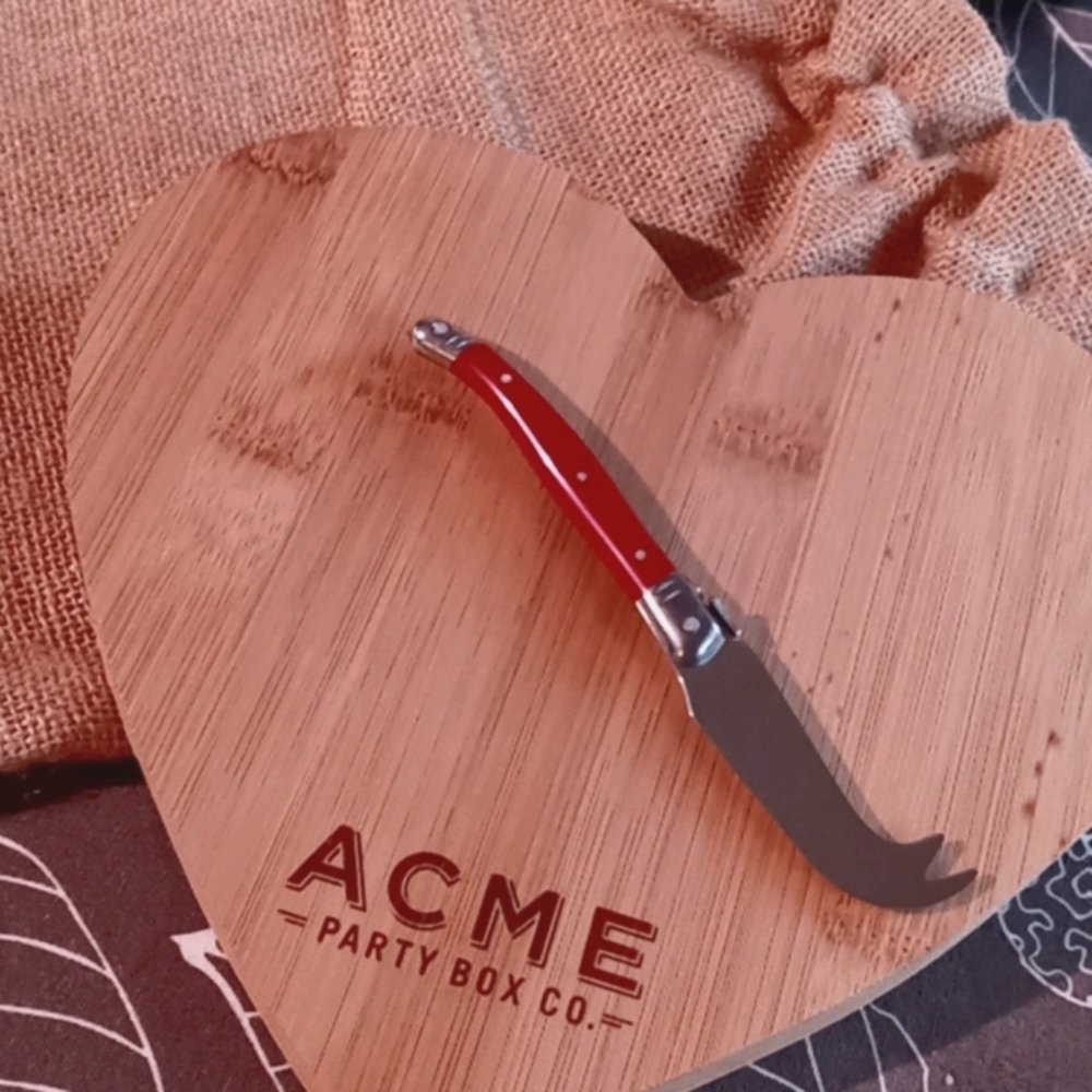 Acme heart shaped cutting board